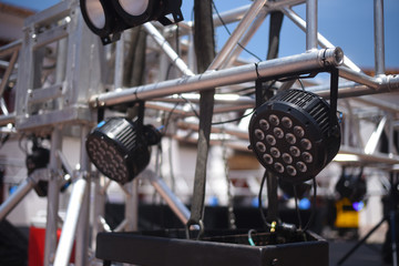 Close up on stage lights on metal frame