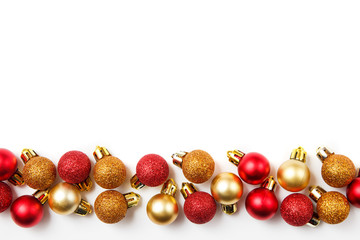 Christmas greating card composition. Christmas red and golden decorations on white background. Flat lay, top view, copy space