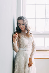 Stylish wedding in European style. Portrait of the bride in the style of fine art, white dress.