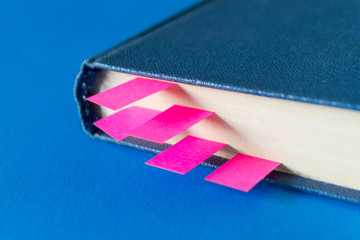 Book with many bookmarks