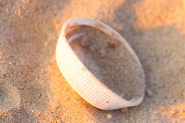 Stopper of plastic bottle on sand