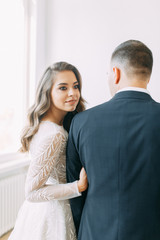 Stylish ceremony in European style. Beautiful couple in the interior Studio.
