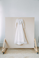 Fototapeta na wymiar Stylish dress in European style. Details of the wedding dress, the morning and the bride's fees.