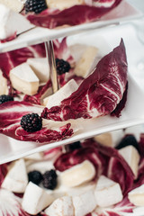 stand with cheese and berries