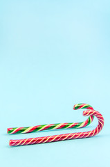 Christmas background. Two different Christmas candy canes, sleigh