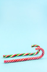 Obraz premium Christmas background. Two different Christmas candy canes, sleigh