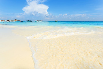 Sea view from tropical beach with sunny sky