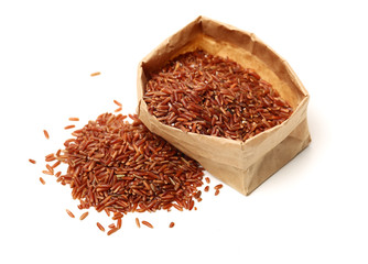 Red rice on white background 