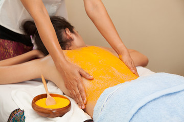 .Asian woman getting a salt scrub on her back beauty treatment in the health spa - 300079581