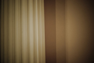 Part of an ancient Greek column on a wall background