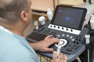 Obraz na płótnie Canvas ultrasound examination at the doctor of a young girl