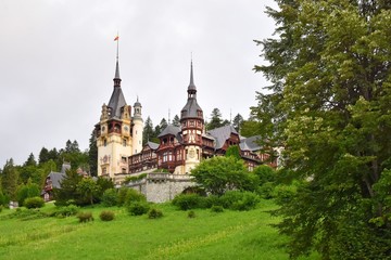 Fototapeta premium Sinaia, Romania - August 2019. Great Pelesh castle and park in Sinaia, Romania. Romania King Carol Palace and park with medieval beautiful buildings 