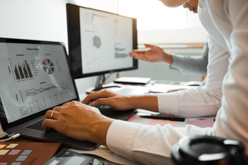 Two entrepreneur person working and colleague analyzing data for new start-up business and marketing.