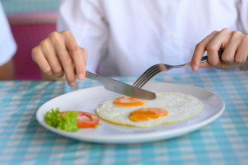 Closeup young women eating breakfast