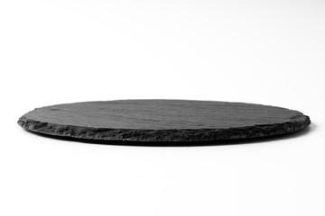Black round stone plate isolated on white - 300085925