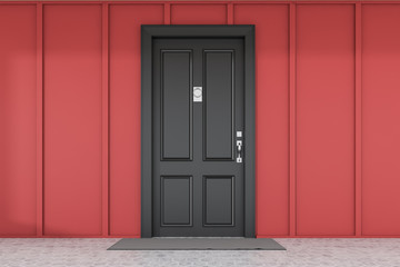 Black front door of red house with mat