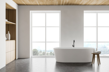 Fototapeta na wymiar Stylish white bathroom interior with cabinet
