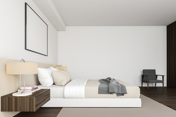 Side view of white bedroom with poster