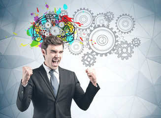 Happy young businessman brainstorming sketch