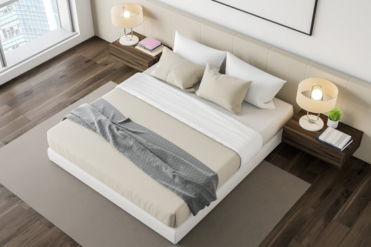 Top view of white bedroom with poster