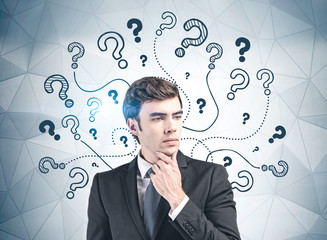 Thoughtful businessman looking for answers
