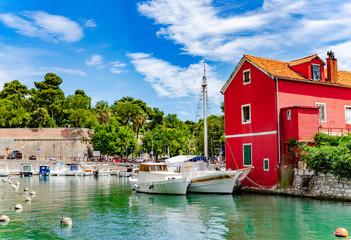 Boats and fishing boats on the pier in Fosa Bay in the spa town of Zadar in Croatia.