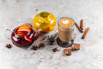 Set of various winter cocktails: mulled wine, eggnog, limoncello, old-fashioned, coconut margarita. White linen background.