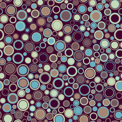 Seamless pattern. Consists of geometric figures having round shape and different color, located on burgundy background. Useful as design element for texture and artistic composition.