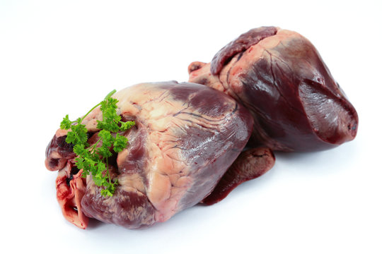 raw pork heart on a white background