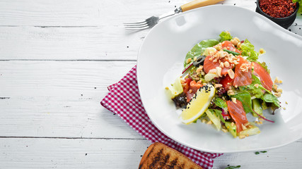 Vegetable salad with salmon fish. Food. Top view. Free space for your text.