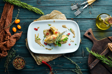 Ukrainian traditional dish. Stuffed cabbage leaves with minced meat and rice. Restaurant dishes. Top view. Free copy space.