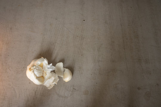 Onion On A Gray Concrete Table Shot From Above