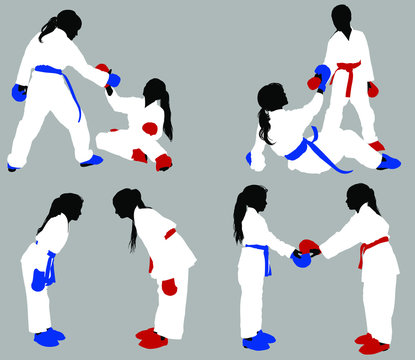 Teenage Karate Girls In White Kimonos And Blue And Red Outfits Help Each Other Out In Training And Show Respect Before The Fight.