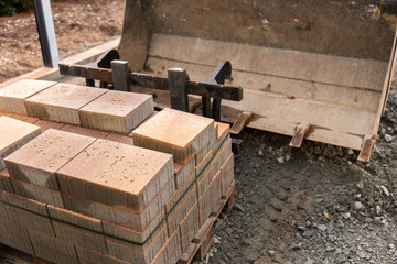 New paving slab on pallet, building materials for the reconstruction of the pavement