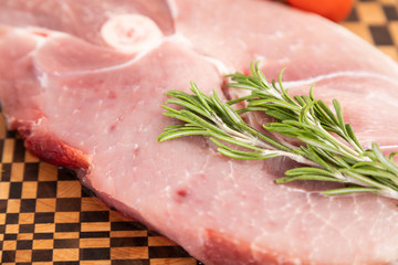 Meat and fresh vegetables on a cutting board