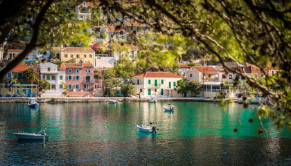 Obraz premium Beautiful landscape with bay and colorful buildings on the background in the town of Asos , Greece, Kefalonia. Wonderful exciting places. Panorama. Amazing Greece - picturesque colorful village