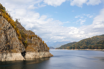 Fototapeta na wymiar Dam and reservoir on Lake Vidraru. Hydropower construction, waterworks Dam Vidrau on Transfagarash highway in Romania