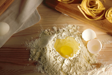 eggs and flour on wooden table