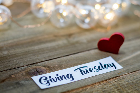 Giving Tuesday donate charity concept with text on wooden board