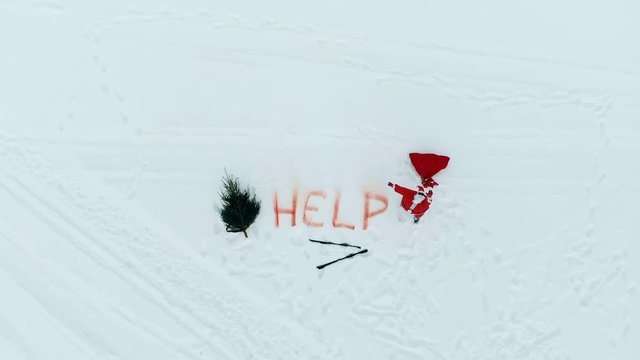 Stranded Santa Claus is asking for help in the snow
