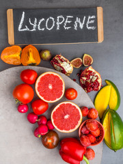 Fruits and vegetables containing lycopene. Healthy vegan food background. Lycopene is a red carotenoid pigment