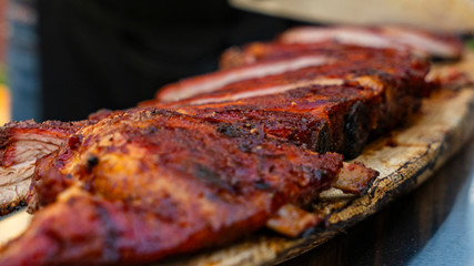 Grilled ribeye steak of marble beef closeup with spices on a wooden Board. Top view.
