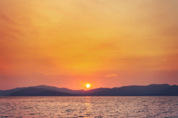 landscape of sunset on the coast sea, waves, horizon. top view.