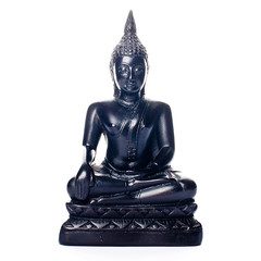 Closeup of an isolated black buddha statue on a white background