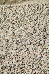 Breakstone background, a pile of crushed stone. Road gravel, gravel texture.  Piles of limestone rocks. Break stones on construction site.
