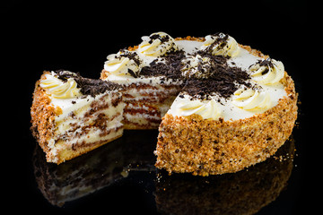 Delicious vegan chocolate cake on vintage wooden table. Selective focus. Copy space for your text.