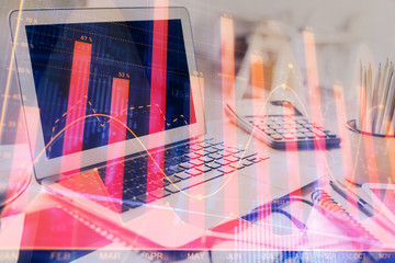 Stock market graph and table with computer background. Double exposure. Concept of financial analysis.