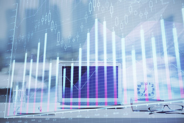 Forex Chart hologram on table with computer background. Double exposure. Concept of financial markets.