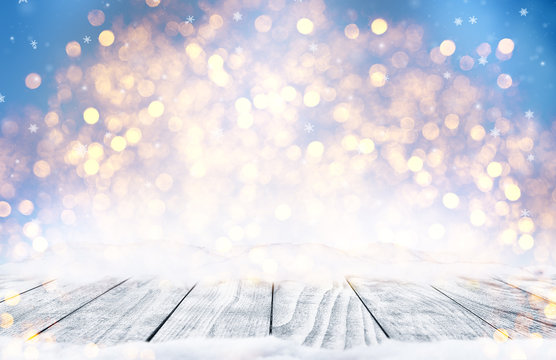 Decorative Christmas background with bokeh lights and snowflakes.