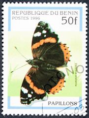Fototapeta na wymiar Beautifully colored butterfly on a postage stamp of the republic of Benin.